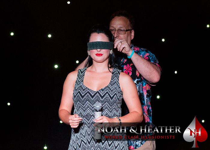 Heather gets blindfolded by a volunteer 