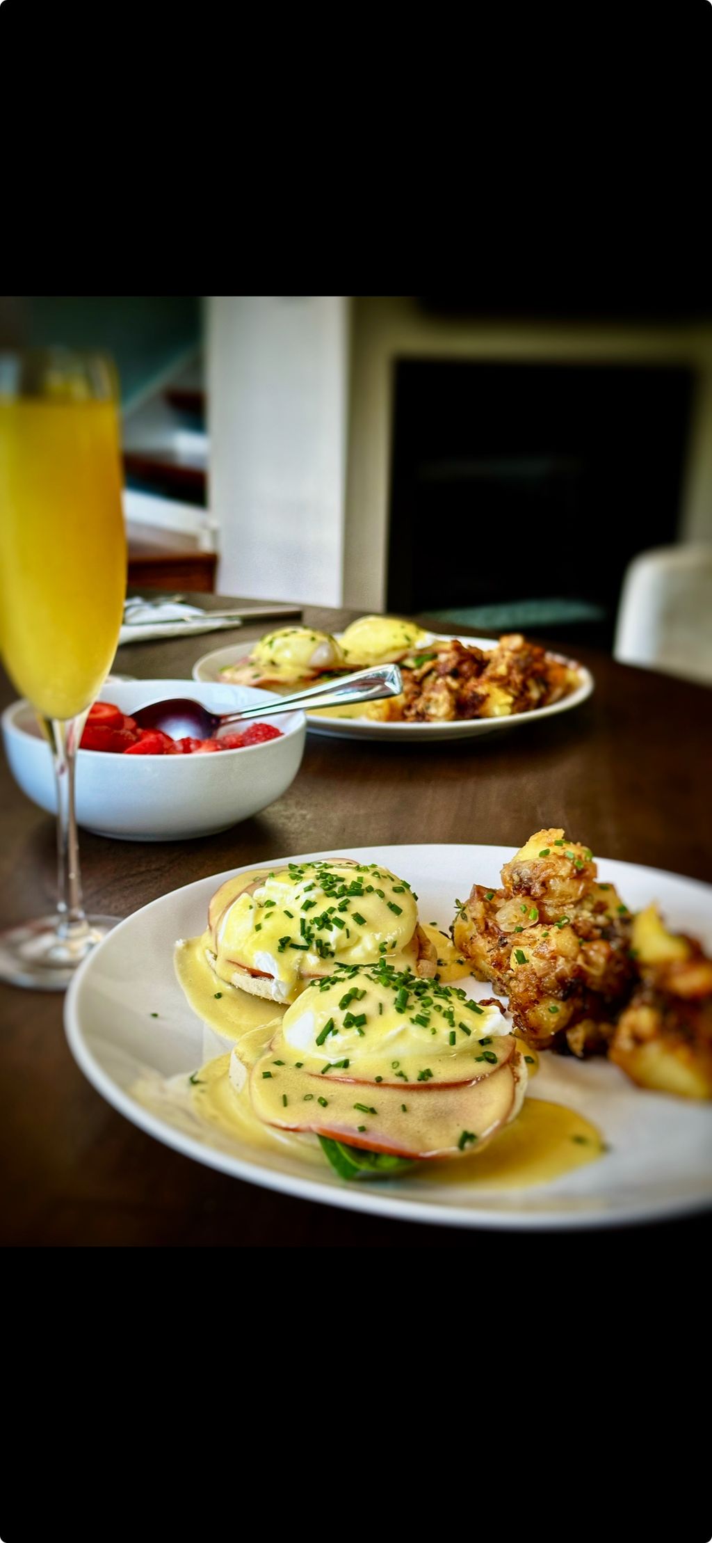 Classic brunch. Eggs Benedict, Yukon potatoes with