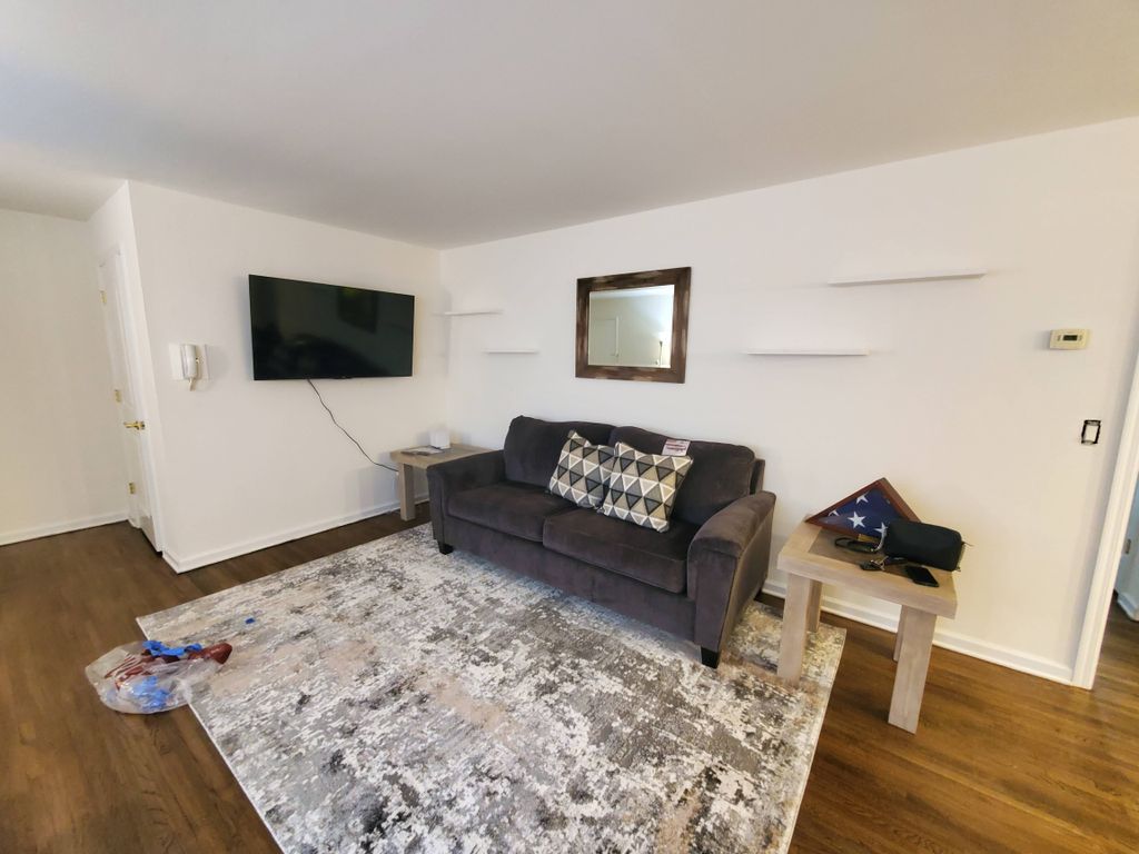 Mounted TV,four floating shelves and mirror 