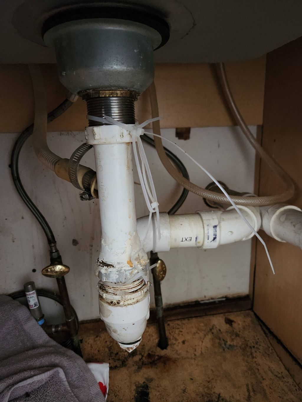 BEFORE: Service call for leaking drain.