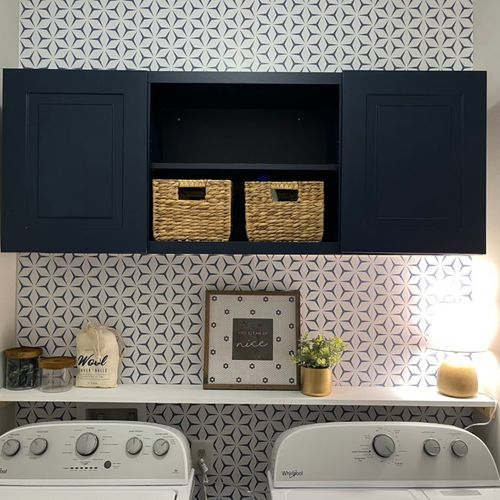 S&S installed a laundry room cabinet and hung wall