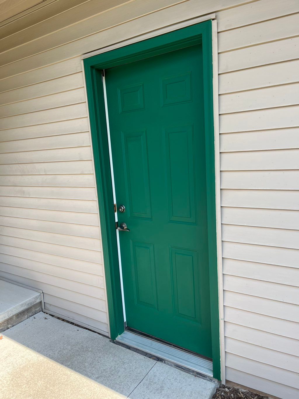 Garage door trim and door primed and painted 