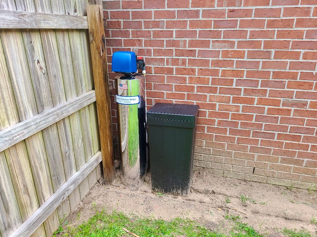 Installed water filtration unit on the side of the