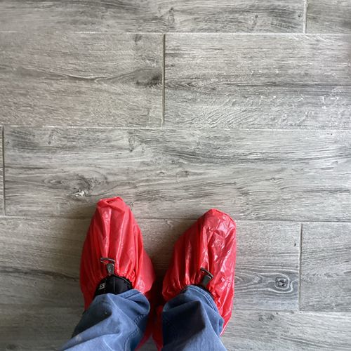 Keeping your house clean by wearing booties! 