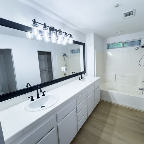 Bathroom faucet, window trim, and vanity light ins