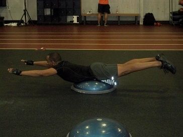 Client using Bosu Trainer for balance