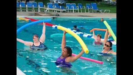 Stretch class in the water using noodles