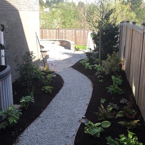 Installed a gravel walkway with new plants, lighti