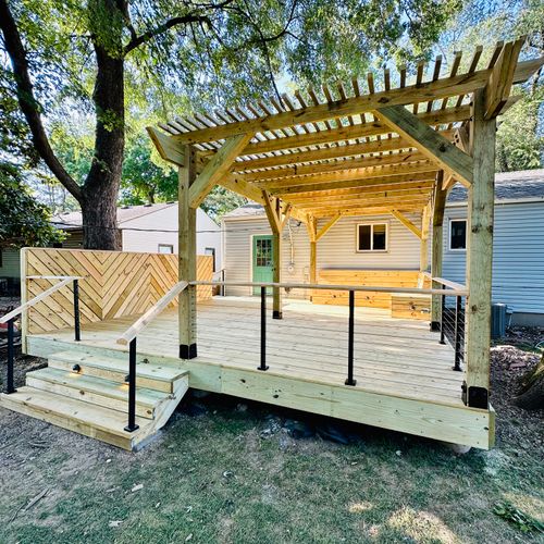 Steel cable railing and timber-framed pergola on a