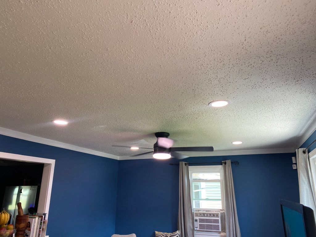 Recessed lights and fan added to living room.