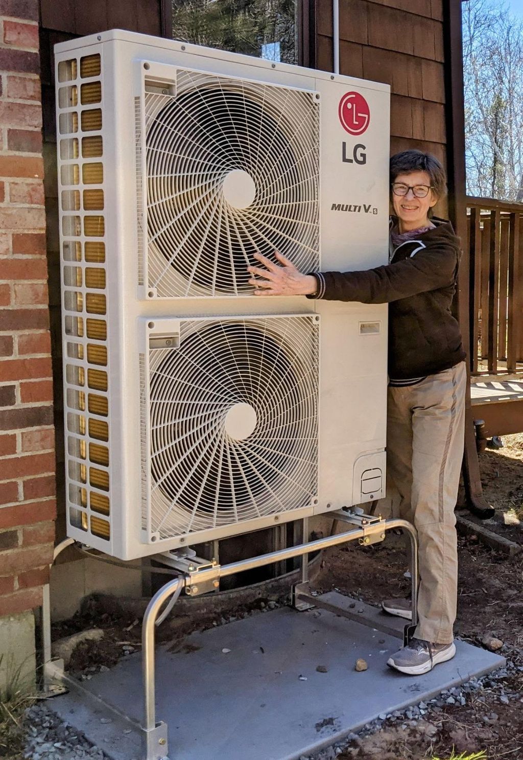 A happy customer with a new LG heat pump system in