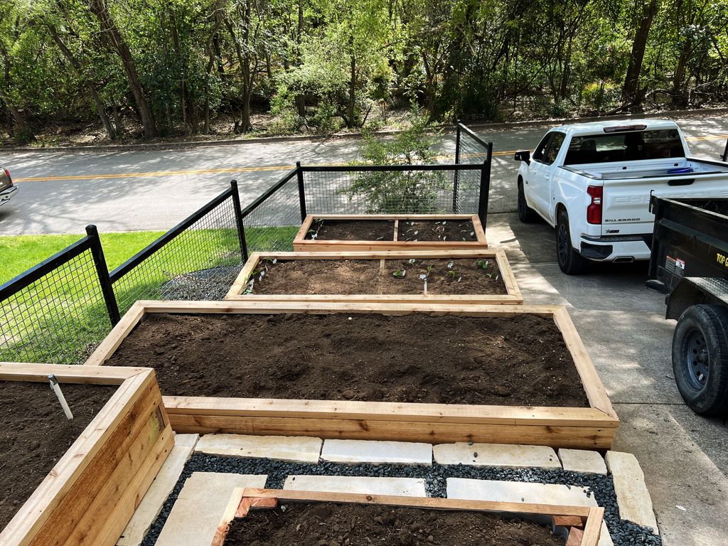 After Landscaping - Custom Rock work and Raised Pl
