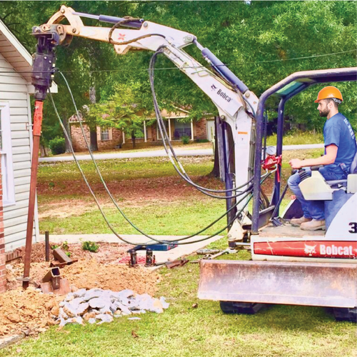 Installing a helical pier.