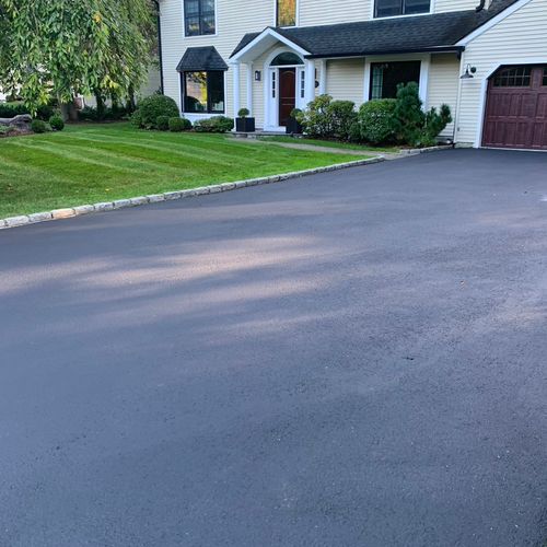 Chris did a great job seal coating our driveway. H