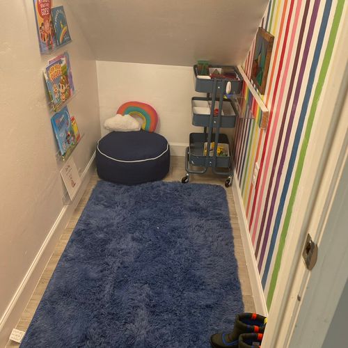 Under stairs kid reading nook 