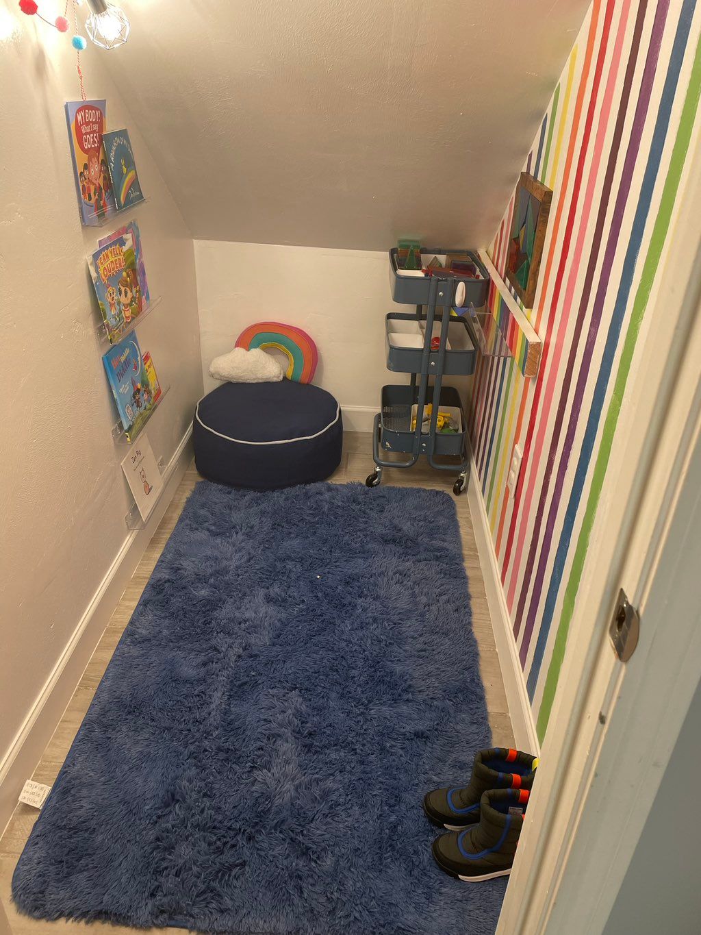 Under stairs kid reading nook 