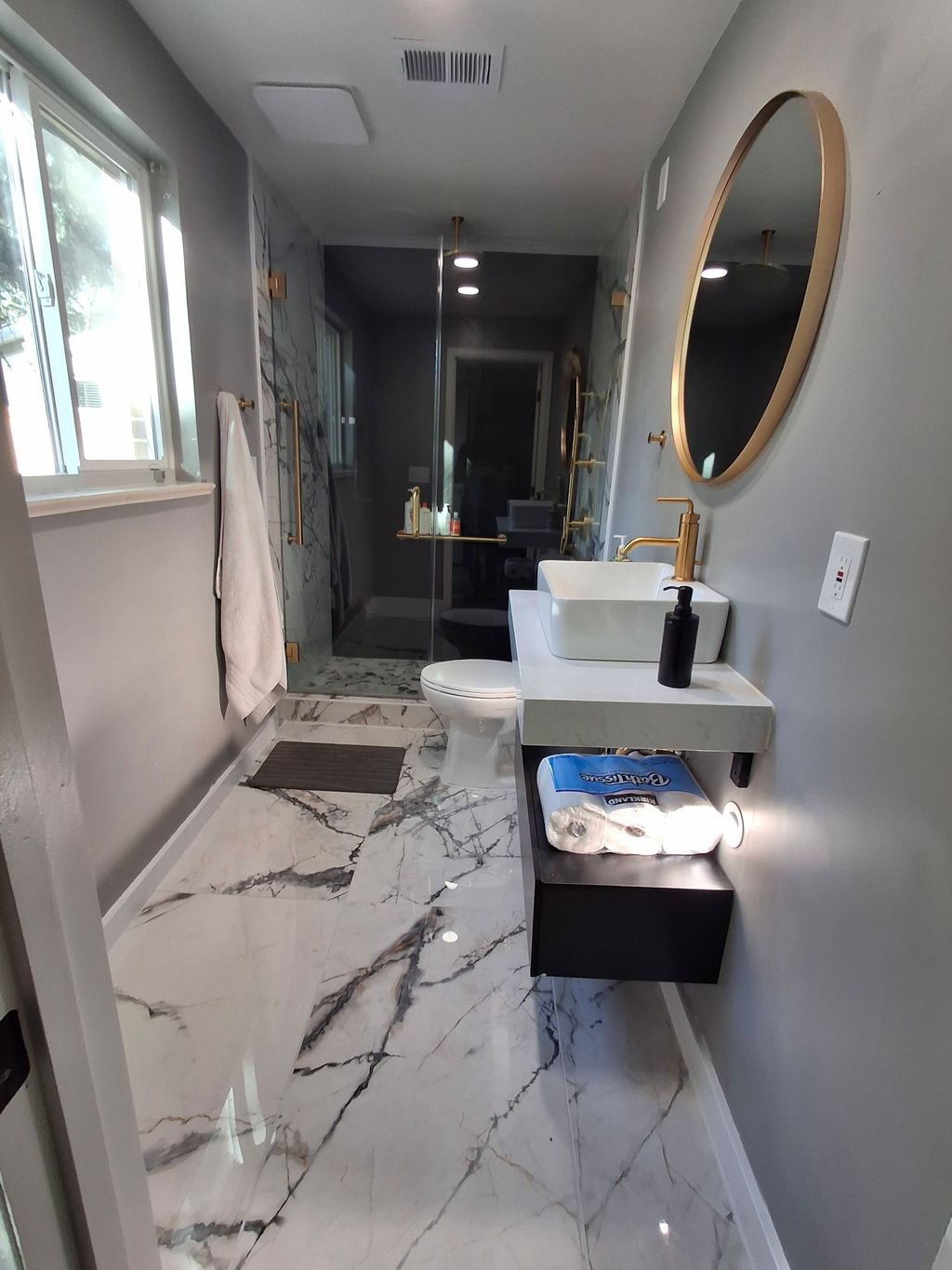 Bathroom renovation.  New 48 inch marble like tile