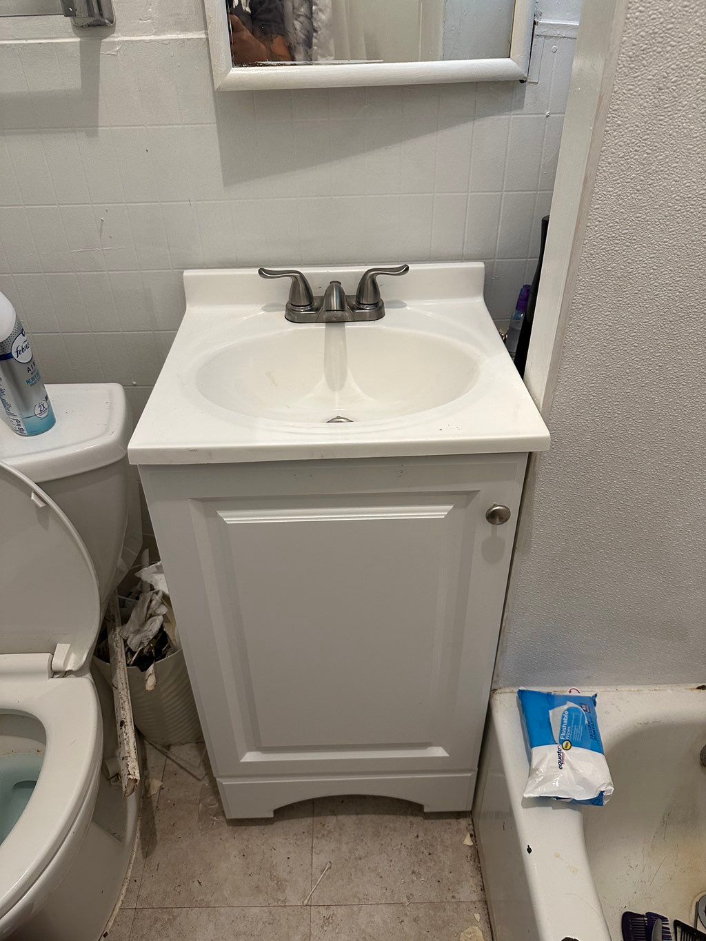 Installation of faucet, washbasin, vanity unit 