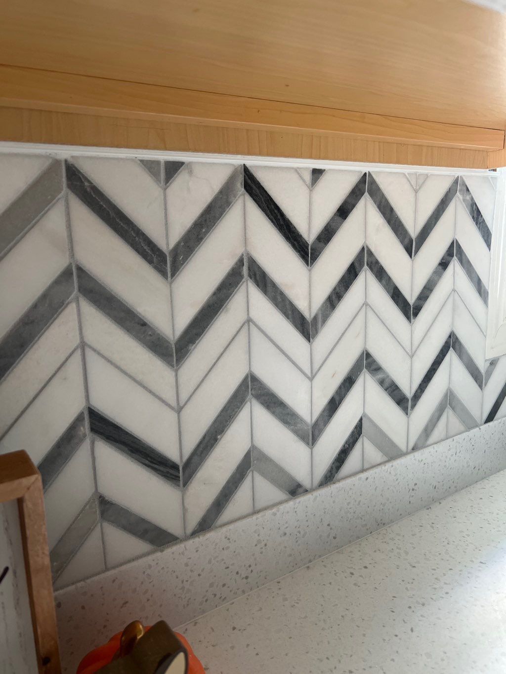 Waterfall tile installation kitchen backsplash 
