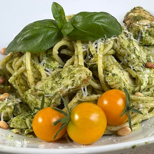 grilled chicken pesto pasta and cherry tomatos