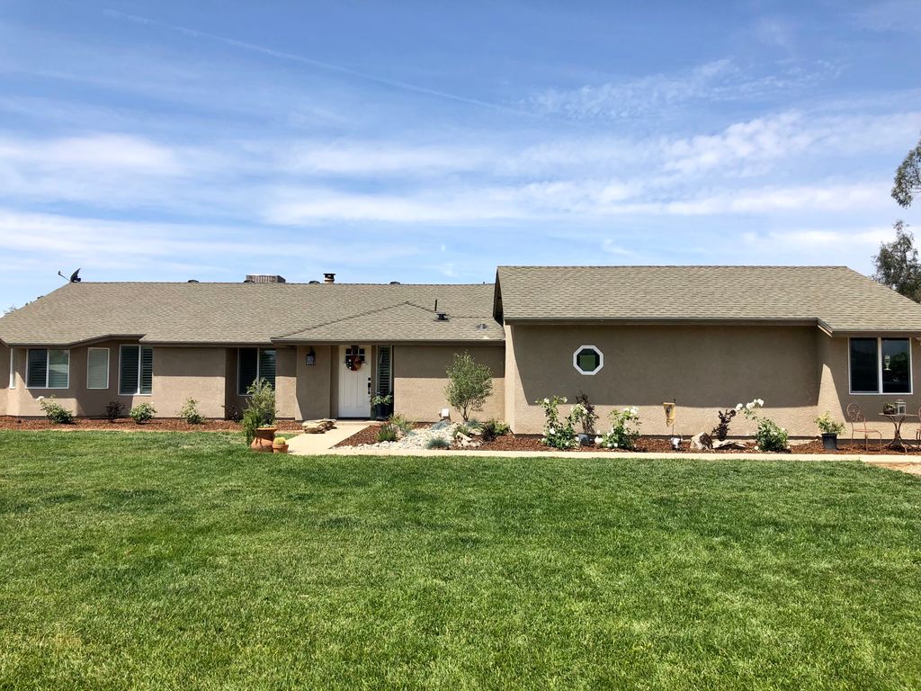 After windows, doors, re-dash, and landscape
