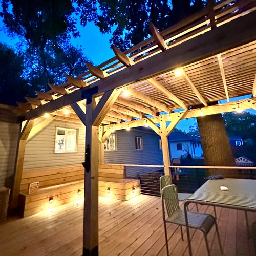 Back deck with custom timber-framed pergola and bu