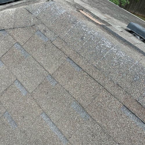 Old and hail damaged roof in San Marcos