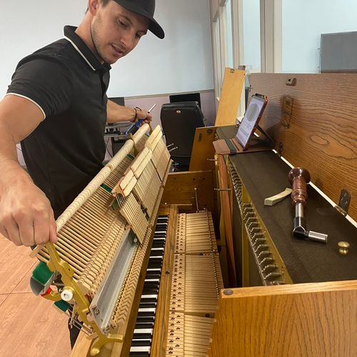 Tuning and repair on a Yamaha P22 at Fort Dix Base