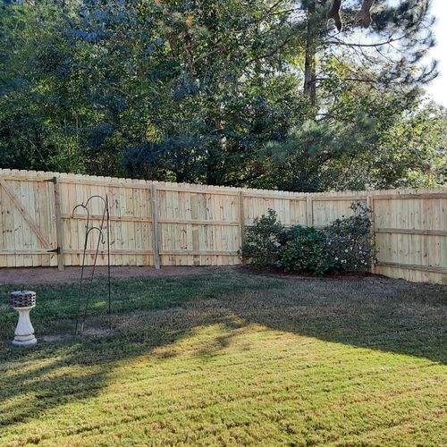 Our new backyard fence could not be more perfectly