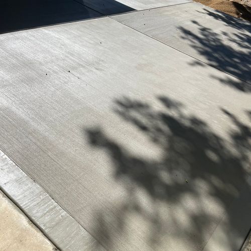 Concrete patio with broom finish. Quad design.