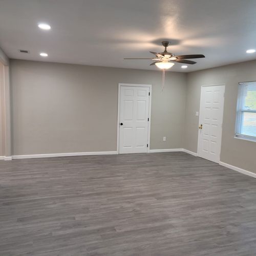 After Floor, baseboards, lighting & door install &