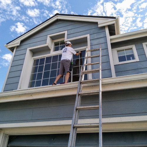 Spotlessly cleaning 2nd floor windows in Richmond!