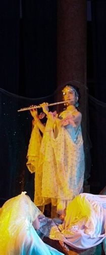 Playing flute in a performance of Shakespeare's "M