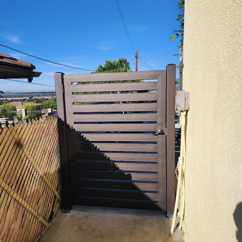 After!! Our bronze textured iron gate adds both se