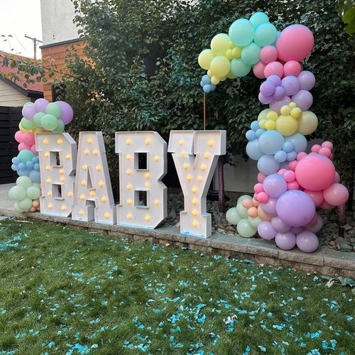 Emma provided a balloon arch for our gender reveal