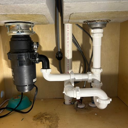 Garbage disposal and drain pipe installed 