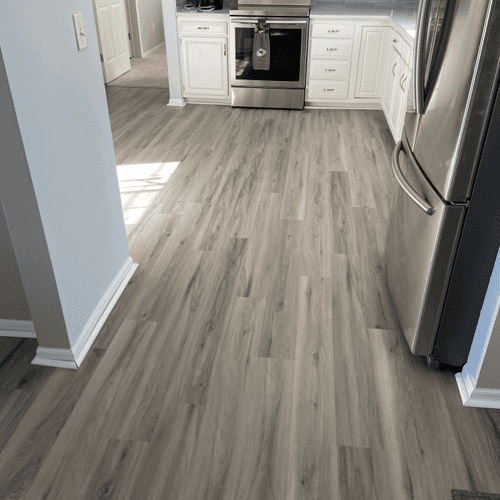 Flooring continued from kitchen to entry and livin