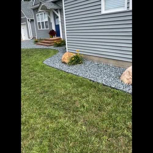 Put in edging laid rock And flowers small boulders