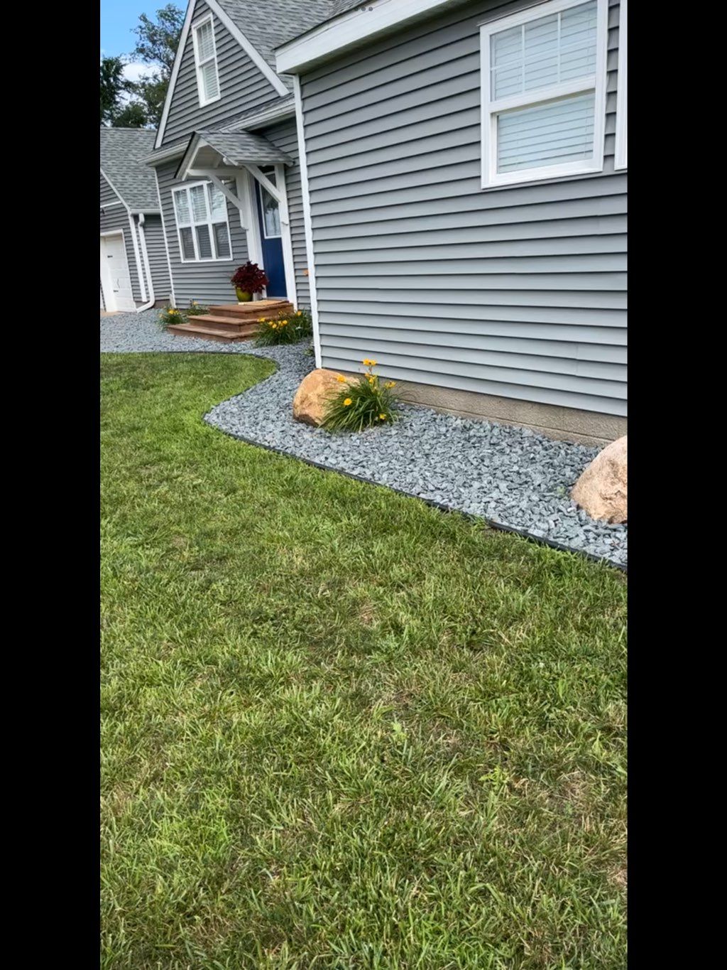 Put in edging laid rock And flowers small boulders