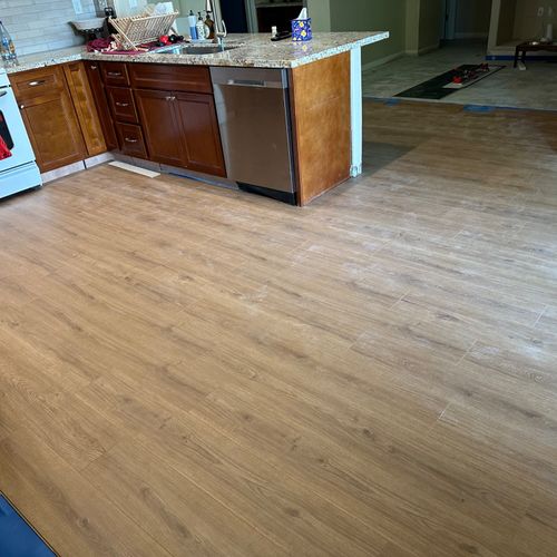 Alex laid laminate flooring throughout the entire 