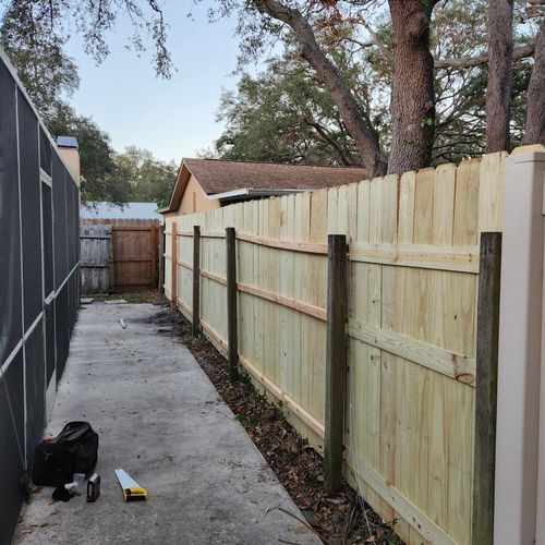 Fence installation. Five sections and one post wer