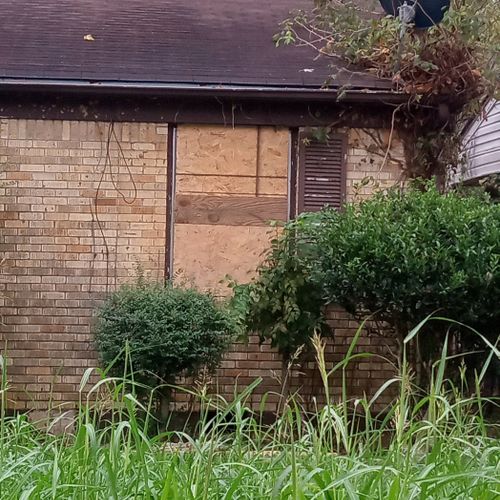 window borded on vacant house 