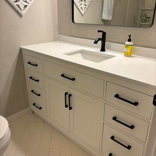 New vanity, countertop, faucet, and mirror. 