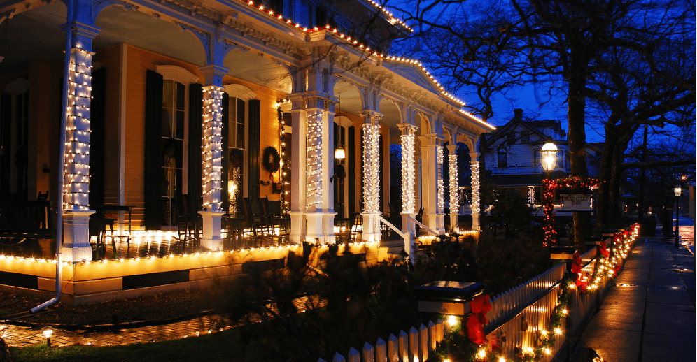 large house covered in holiday lights