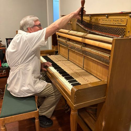 We had Alan come and work on our piano. He opened 