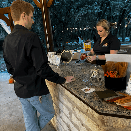 Bartender Ashlee serving at The Backyard Venue in 