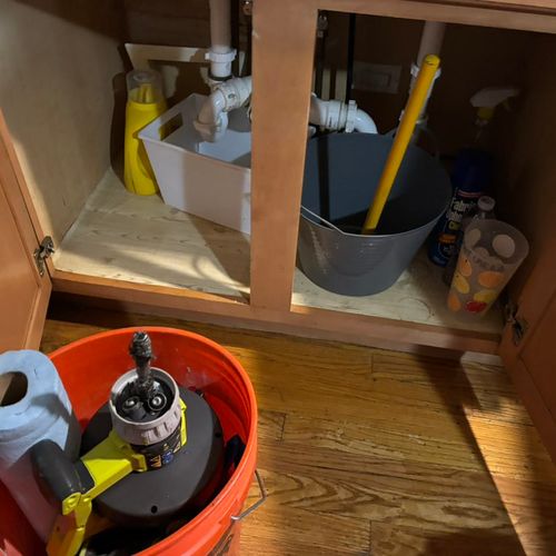 Setting up to unclog a kitchen drain