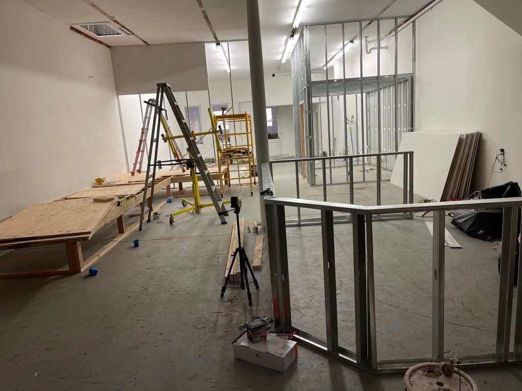Demising wall framing and drywall hanging.