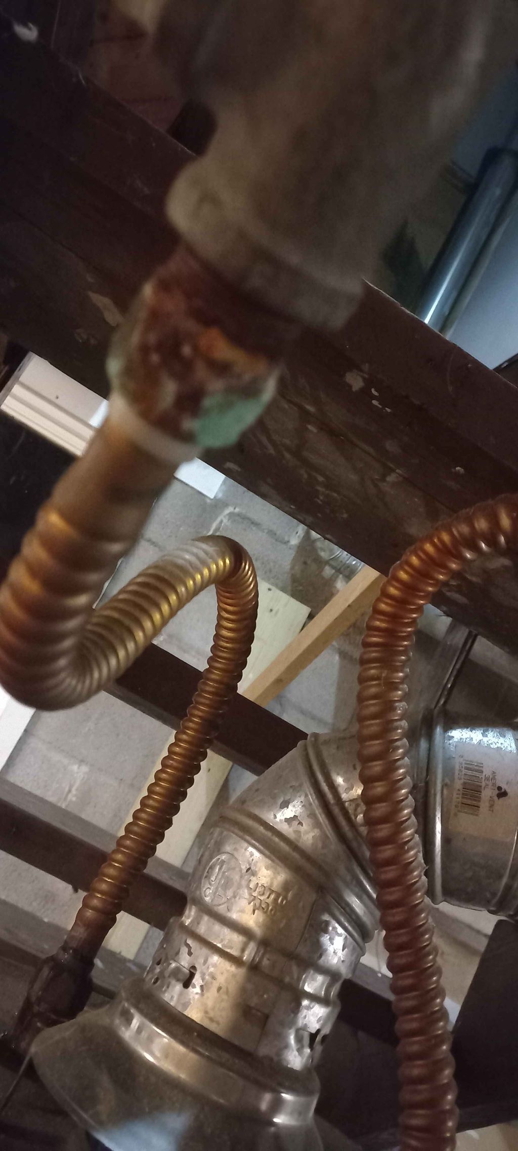 before on water heater repipe.  crusty fittings in