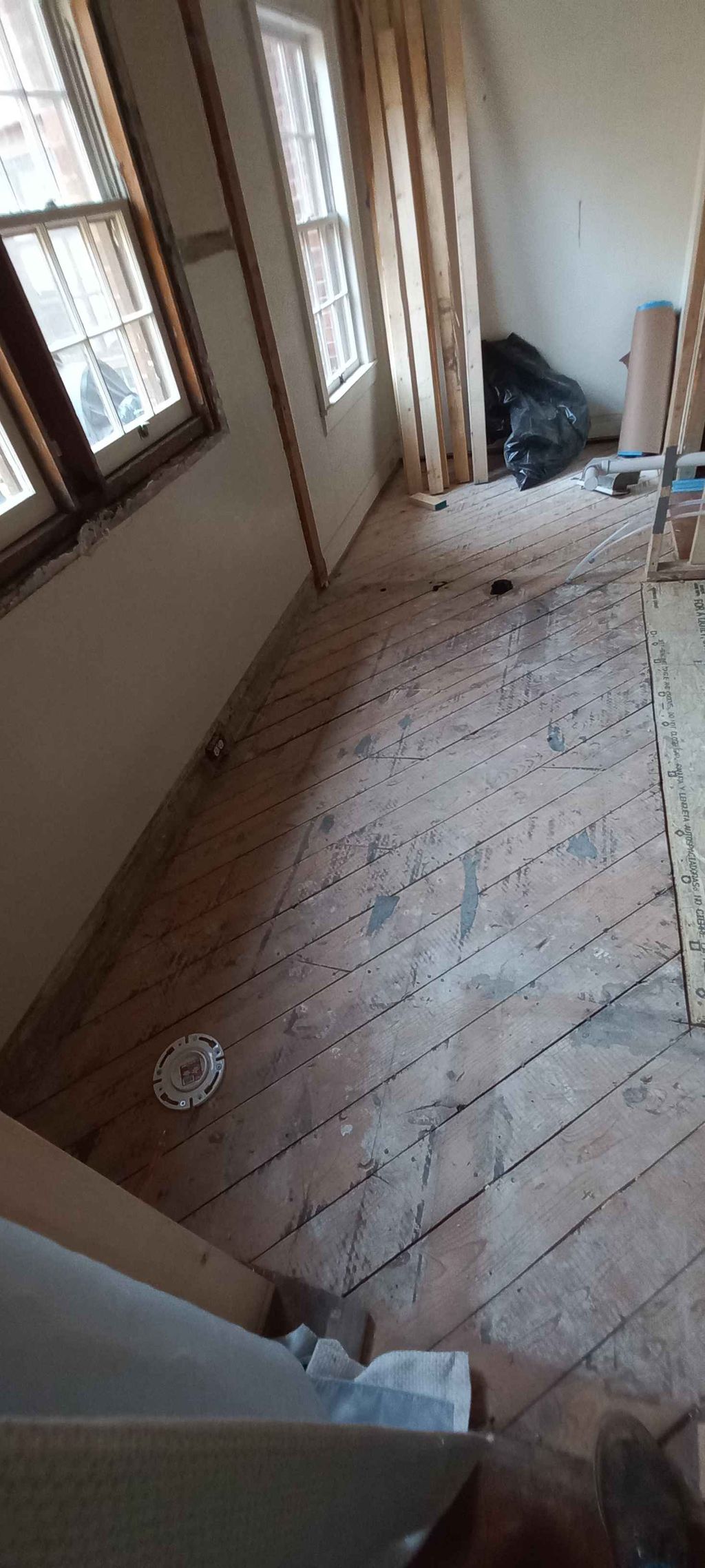 floor cleaned after rough in plumbing for master b